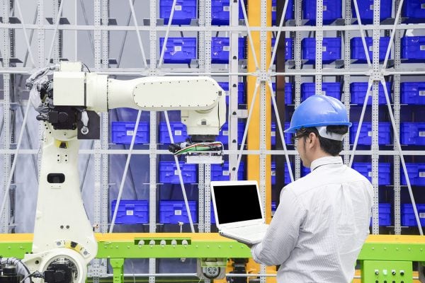 The programmer engineer control the robot for logistic warehouse